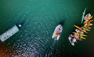 In the harbor channel, 17 boats, mostly kayaks, rafted up with a large floating banner, “Stop Tyranny”. (Photo by Jim Dugan)
In the harbor channel, 17 boats, mostly kayaks, rafted up with a large floating banner, “Stop Tyranny”. (Photo by Jim Dugan)