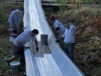 Abe Rhode, Kristi Van Blarcom, Ian Bogey, David Garner paint the toboggan chute with a fresh coat of white paint Oct. 5. (Photo courtesy Peter Berke) Abe Rhode, Kristi Van Blarcom, Ian Bogey, David Garner paint the toboggan chute with a fresh coat of white paint Oct. 5. (Photo courtesy Peter Berke)