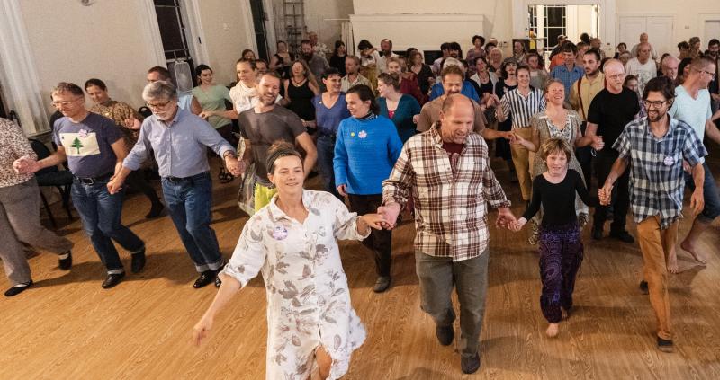 (Photo by Dylan Ladds) People line dancing