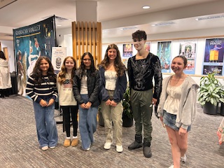 (Photo courtesy Julie Fajardo) Six attendees pose for a picture in a lobby