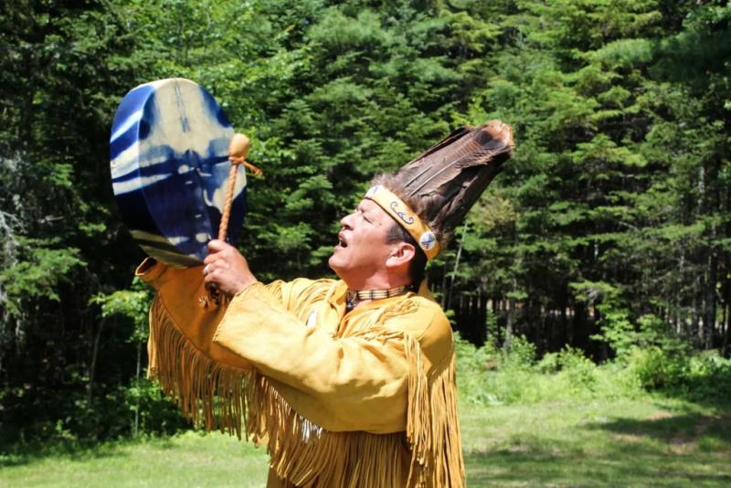 Dwayne Tomah sings a Passamaquoddy song outside of his home in Perry, Maine. (Photo by Robbie Feinberg/Maine Public, provided to Pen Bay Pilot by Camden Public Library) Dwayne Tomah sings a Passamaquoddy song