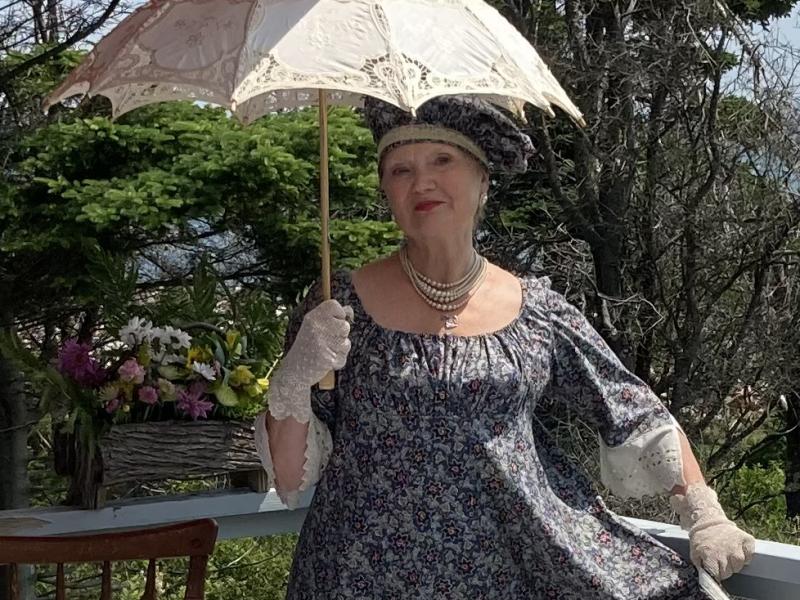 woman, grayish dress, parasol