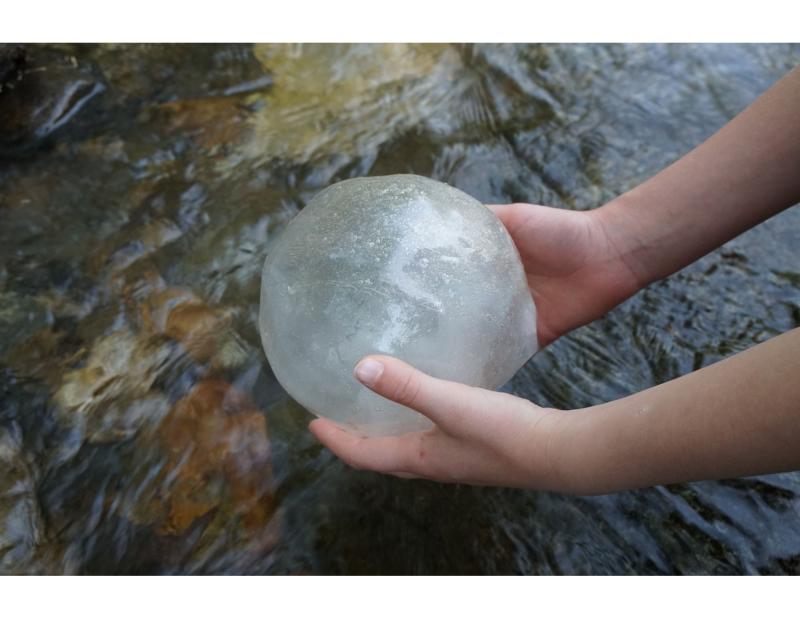 orb held above water