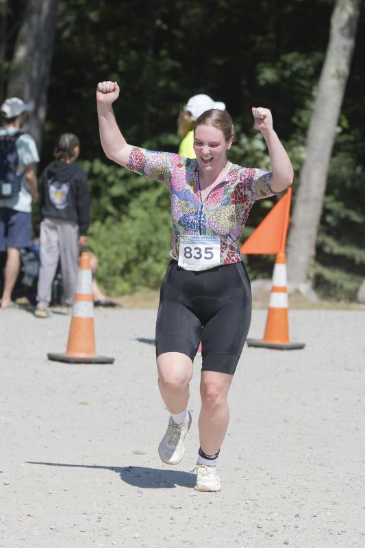 female athlete raises cheers