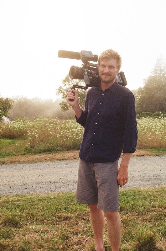 Director Luke Lorentzen holding a video camera