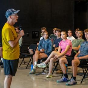 Peter Madigan (l), a lecturer with the University of Maine Cohen Institute and chair of its board of directors, speaks with rising high school seniors during the institute's Summer Leadership Program, which trains some of the state's most promising students to become future public service leaders. (Photo courtesy University of Maine) 