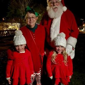 Santa, elf, and two children at Christmas By The Sea. 
