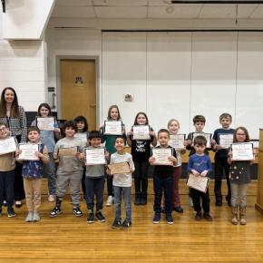 Large group of students plus principal