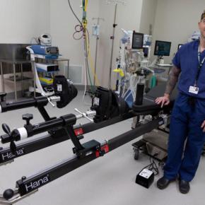Dr. Zethariah Zielinski stands and surgery table