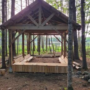 wooden structure with bench seats