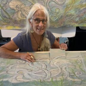 female shows tile mural