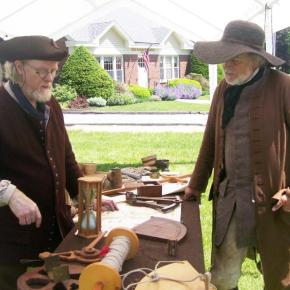 two men in colonial apparel