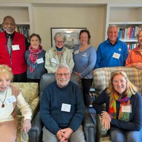 Nine adults pose for picture