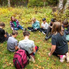 students sit in a circle