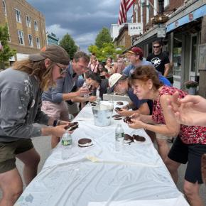 people at long table competing