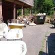 Mr. Tubs, surrounded by unrestored bathtubs takes a call outside his workshop. (Photo by Ethan Andrews)