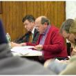 David Italiaander, center in red, testifies against the tank Wednesday night. Italiaander is flanked by attorneys Ed Bearor, left, and Steve Hinchman, right. (Photo by Ethan Andrews)