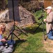 Cynthia MacDonald and Dennis Steinauer photograph dandelions for the Kansas to Oz class. (Photo by Chris Wolf)