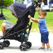 This young man pushed a stroller with his big brother as passenger along the Harborwalk at the 17 th annual Belfast Harbor Fest, hosted by Belfast Rotary Club, on Aug. 18.