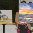 Pictured here at Belfast Rotary Club’s Evening by the Bay gala and auction, the event that launched the 17th annual Belfast Harbor Fest on Aug. 17, are a rendering of the club’s $200,000 centennial playground Legacy Project (left), to be built at City Park in Belfast in 2025, and “Glow,” an original oil painting by Jerri Finch which went to the high bidder at the live auction.