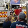 Firefighter Dylan Cautela hoists hose. (Photo by Tim 