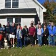 Volunteers with Midcoast Habitat for Humanity join organizers, supporters, and the selected family for a dedication ceremony, Oct. 12, 2024. (Photo by Sarah Thompson)