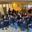 Teammates from Bank of America Belfast Support Services show off their custom 25-year anniversary T-shirts during the celebration at the Belfast financial center in August 2024. (Photo courtesy Bank of America)