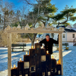 Aaron Margolis and his Menorah in 2024, cedar, copper, found materials. (Photo courtesy Parsonage Gallery)