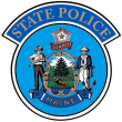 Maine State Police insignia.