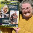 Ashley Vissers holds the poster featuring her and her mother. On March 12, Ashley joined four other domestic abuse survivors in Belfast, where 20 businesses said YES to displaying the posters. (Photo by Patrisha McLean)
