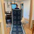 Sarah Leighton and an example of her hooked rug art. (Photo courtesy Rockport Public Library)