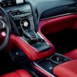 For 2025, the RDX cabin has been upgraded with more leather and Ultrasuede, a roomier bin in the console, easier access to the phone charging pad and more ambient lighting. The knob in the center is the drive mode selector; beneath that lie the P-R-N-D buttons, with a second setting on the Drive button for S, Sport. And below them is the computer touchpad. 