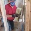 Rotarians regularly contribute to Habitat efforts, improving the energy efficiency of existing spaces. (Photo courtesy Midcoast Habitat for Humanity)