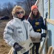 A dedicated volunteer installs house wrap and siding to prevent mold, rot and energy loss, creating a healthier home. (Photo courtesy Midcoast Habitat for Humanity)