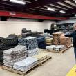 David Whitney poses for a photo in his warehouse.