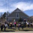 a crowd of library supporters in front of the Waldoboro Public Libraryy