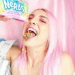 Girl eating nerds candy