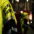 A uniform jacket hangs in the Rockland, Maine Fire House. (Photo by David Troup)