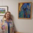 Artist Camilla Jewett stands with some of her works, now on display at MaineHealth Waldo Hospital. (Photo courtesy MaineHealth Waldo Hospital)