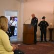 Attendees filled the center room of Burpee, Carpenter and Hutchins Funeral Home with a few stragglers watching monitors in the wings. (Photo by Sarah Thompson)