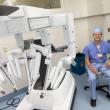 Nathan Elwood, MD, a surgeon at MaineHealth Pen Bay and the new surgical robot. (Photo courtesy MaineHealth)