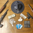 Pictured are the drugs, weapons, and cash collected from the residence. Image courtesy of Maine State Police.