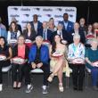 Patriots Chairman and CEO Robert Kraft, Patriots Executive Director of Community Affairs Andre Tippett and Procter & Gamble’s VP of Communications & Community Affairs, Global Grooming, Kara Buckley take a group photo with the 2025 Myra Kraft Community MVP Award winners at Gillette Stadium. (Photo courtesy Eric J. Adler/New England Patriots)