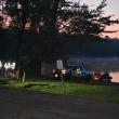 As the Union rescue boat is pulled from the water, Union firefighters confirm their plan to hand over all operations to the Maine Warden Service as the search continues for an overdue paddle boarder. (Photo by Sarah Thompson)