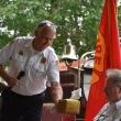 Camden Fire Chief Chris Farley presents the "Chiefly" gift to Keller. (Photo by Sarah Thompson)