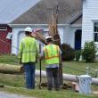 The bottom portion of a snapped utility pole is pulled from the ground following a single-vehicle crash on Hathorne Point Road, July 22, 2025. (Photo by Sarah Thompson)
