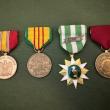 (l-r): Medals received for completing boot camp, time served in Vietnam during the war, and for honorable discharge. (Photo courtesy Danny Swindler/Dawn Bailey)