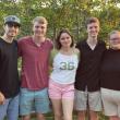 Five young people grin at the camera