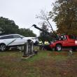 picture of damaged car and the wrecker