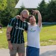 (Now) This summer, Gareth Robinson of Auburn (L) and Michael Thibodeau of Woolwich (R) recreated a favorite childhood photo of themselves at Pine Tree Camp. (Photo courtesy Pine Tree Camp)